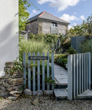 garden with gate and gravel pathway