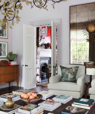 Neutral living room with large coffee table decorated with books