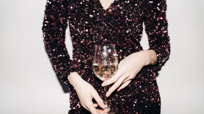 Close up of woman hands with champagne glass