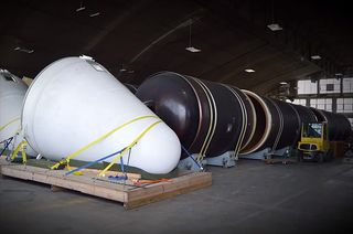 Parts of a Titan 4B rocket are seen inside the National Museum of the U.S. Air Force's restoration hangar. The launch vehicle is being restored for its display in the Dayton, Ohio museum's new fourth building, scheduled to open in 2016. 