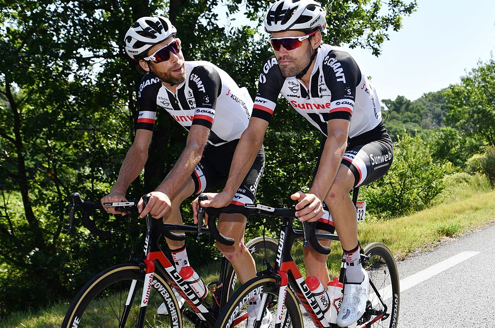 Tom Dumoulin and Laurens ten Dam have a chat while on a rest-day training ride at the Tour de France