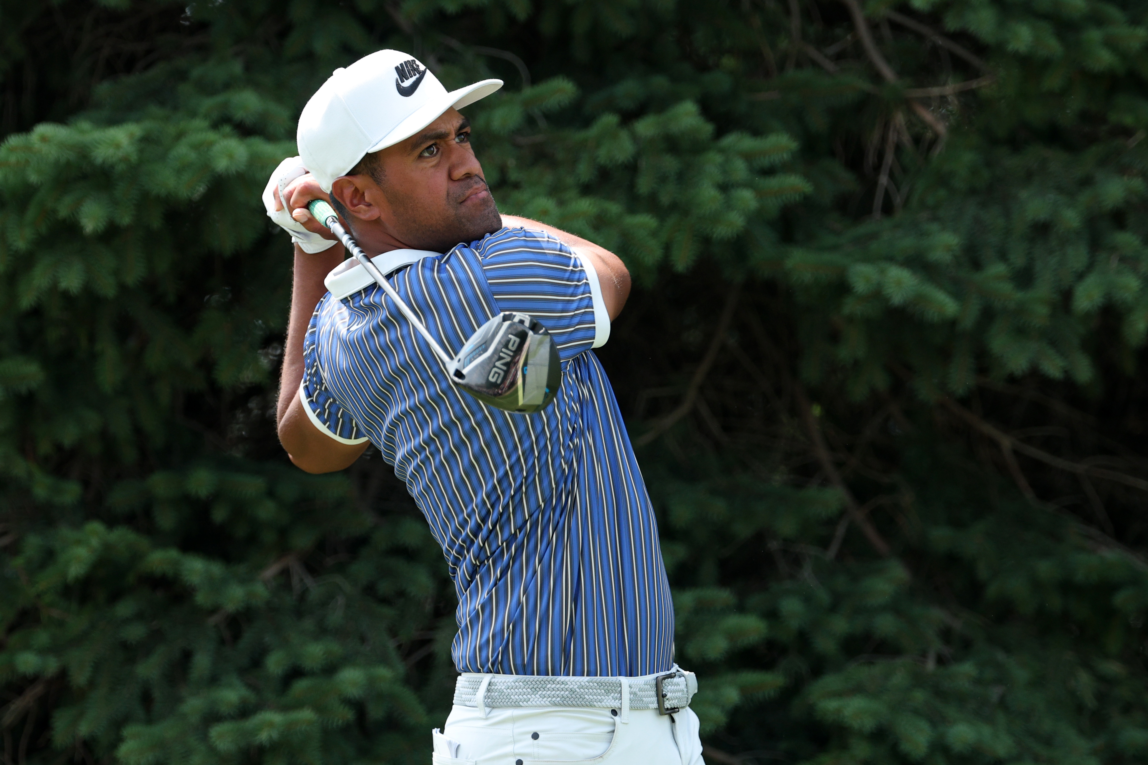Tony Finau hits a driver