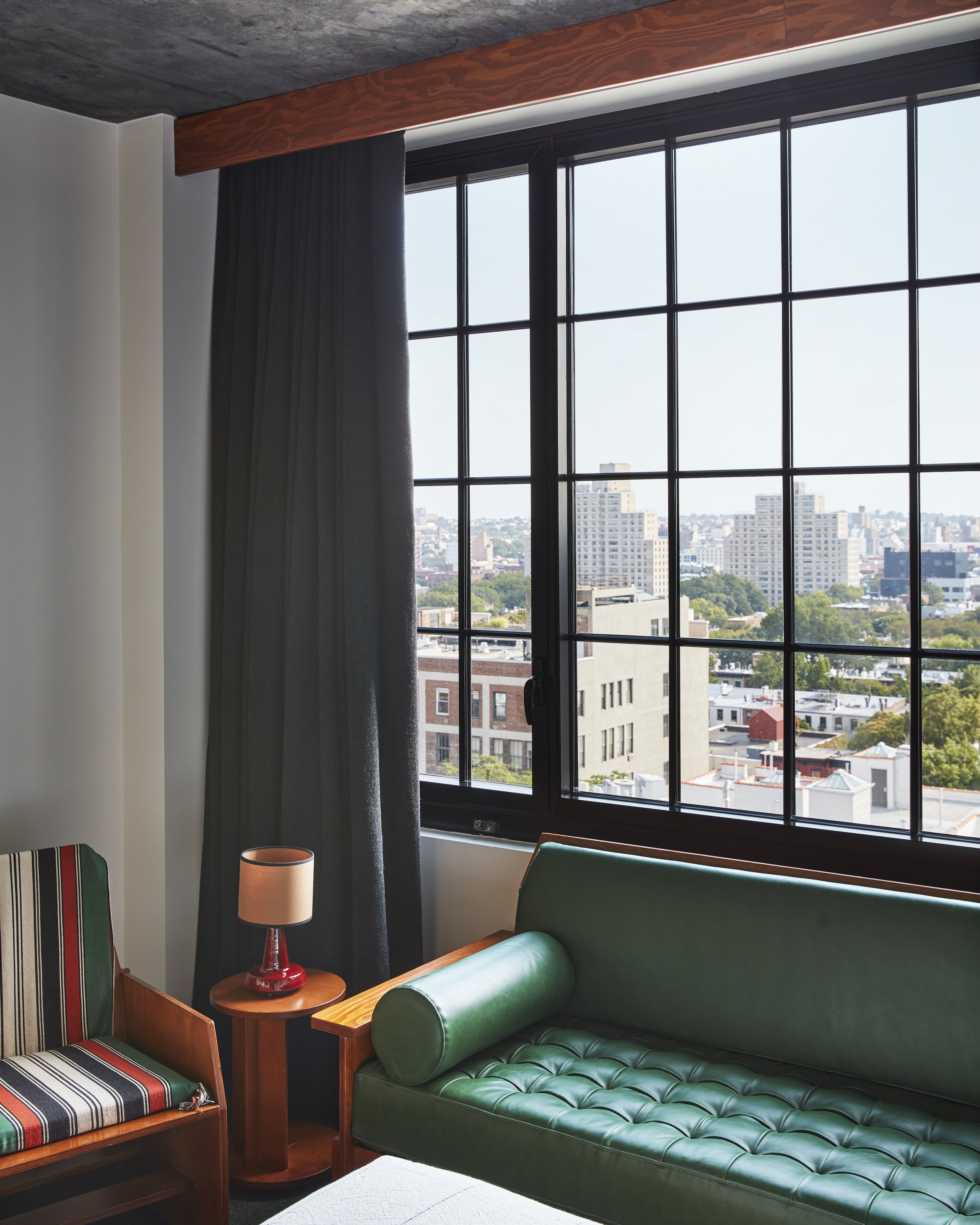 Brutalist-style hotel interior with mid-century furniture