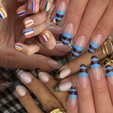 A collage of striped nail art designs.
