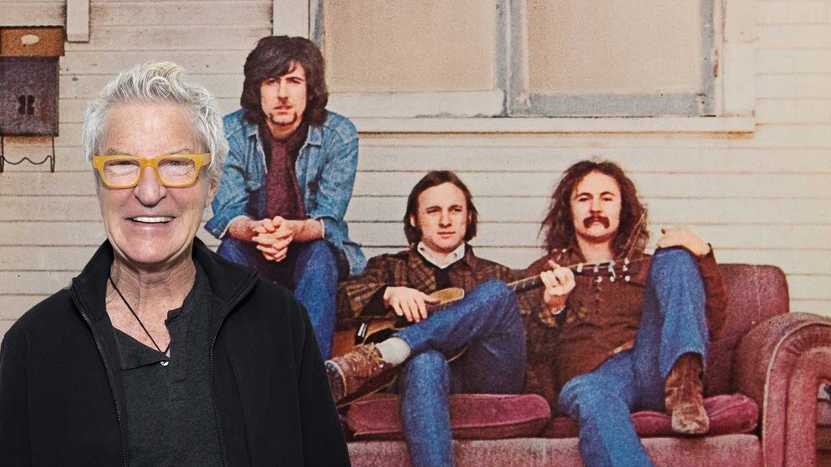 Kevin Cronin standing in front of detail from Crosby, Stills &amp; Nash album cover 