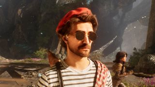 Gustave stands in the foreground wearing beret and striped shirt
