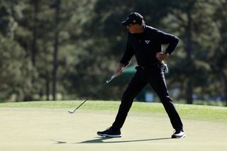 Mickelson holes his putt at the 18th hole and fist pumps