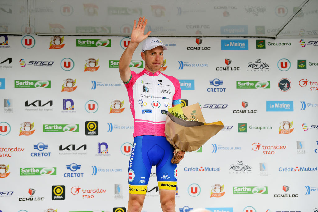 LE LUDE FRANCE APRIL 06 Mael Guegan of France and Team U Nantes Atlantique celebrates winning the pink mountain jersey on the podium ceremony after the 68th Circuit Cycliste Sarthe Pays de la Loire 2022 Stage 2 a 1747km stage from Le Lude to Le Lude CircuitSarthe on April 06 2022 in Le Lude France Photo by Dario BelingheriGetty Images