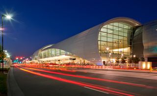 San Jose, California, airport terminal with enormous glass tube fitted with a perforated metal skin