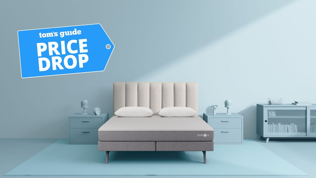 White and grey Sleep Number c2 smart bed discounted in Veteran&#039;s Day deal in blue studio bedroom