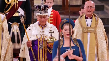 Penny Mordaunt, as Lord President of the Council, carries the sword of state