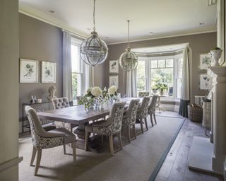 Dining room curtain ideas with a neutral, traditional dining room with white curtains and green block at the bottom