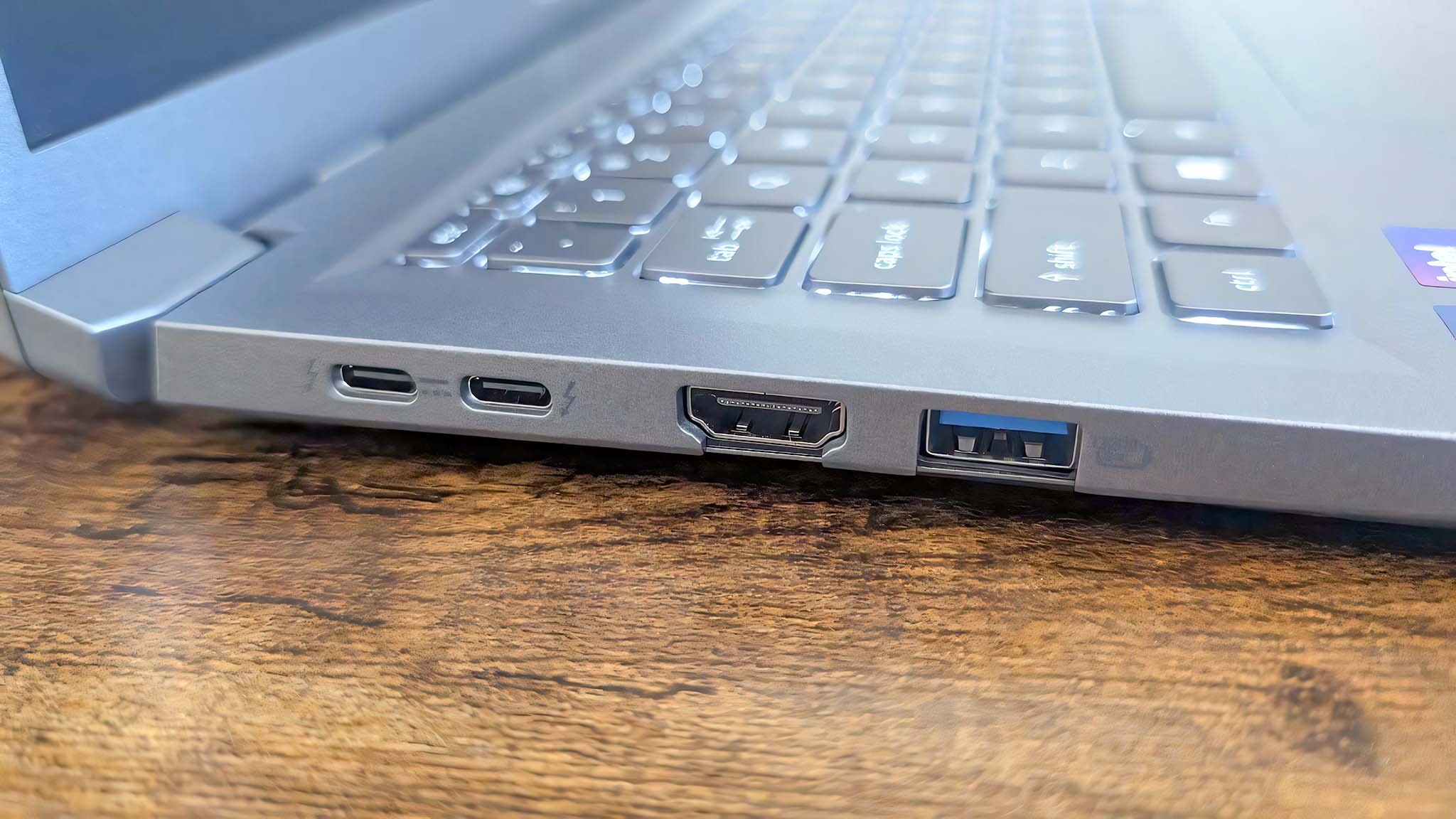 Closeup of the Acer Aspire 14 AI's right side, showing two USB-C ports, an HDMI port, and a USB-A port. 