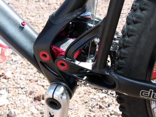 The new asymmetrical chain stay yoke is heavily machined and the lower link gets a dose of carbon.