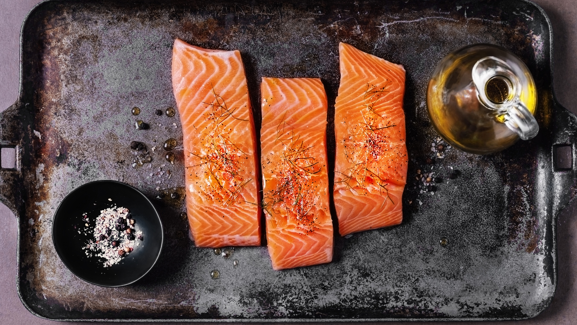 seasoned salmon filets on a tray