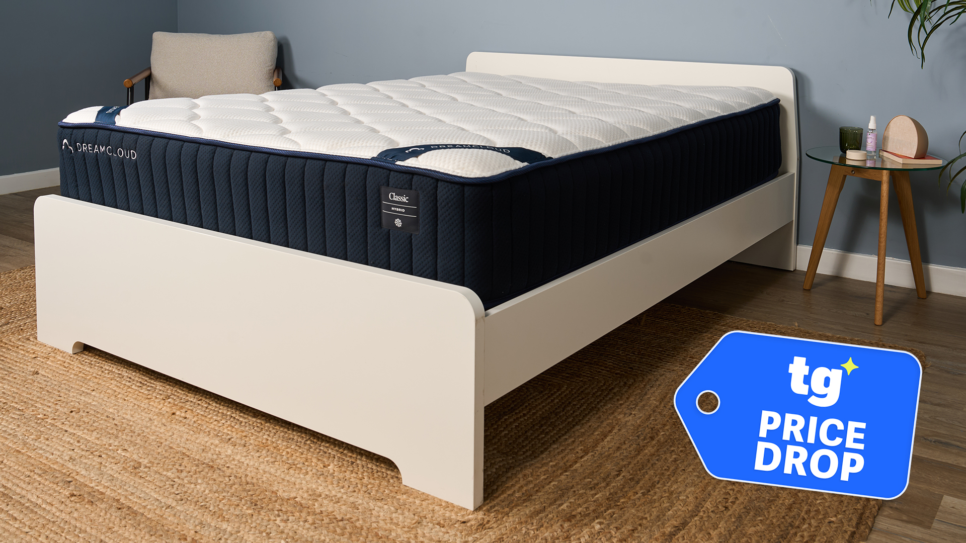 The DreamCloud Classic Hybrid Mattress on a bed frame in our sleep studio, a Tom's Guide Price Drop deals graphic in the bottom right corner