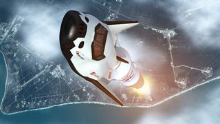 An artist's concept of the Dream Chaser space plane headed into orbit atop a rocket.