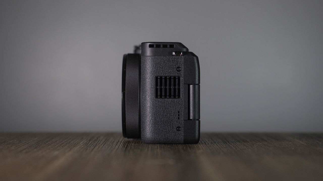 Canon PowerShot V1 on a wooden surface