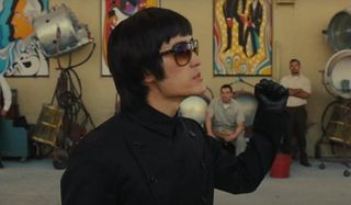 Once Upon A Time In Hollywood Bruce Lee shows his fist on the backlot