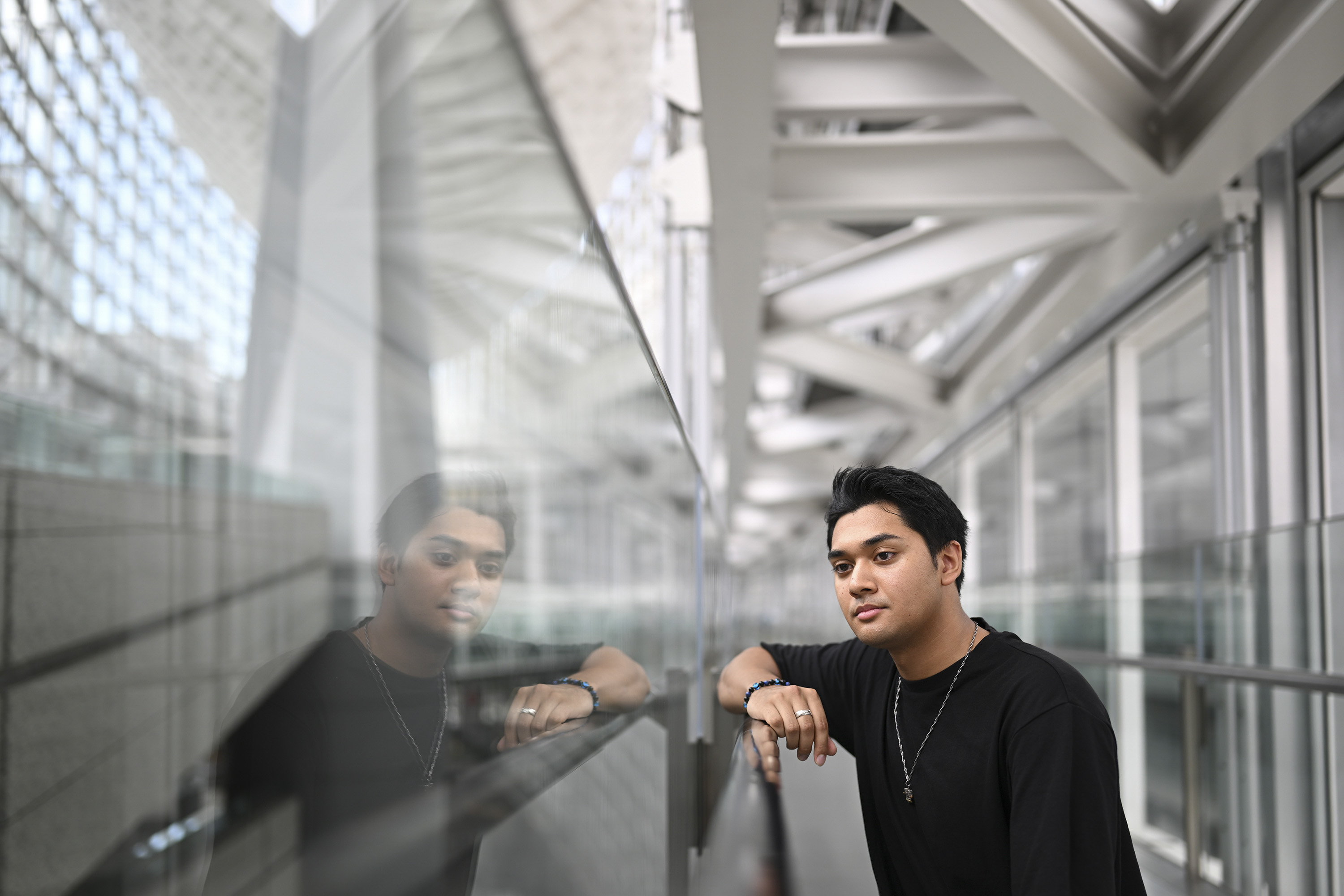 Portrait of man inside grand modern building, taken with Nikon Z 35mm f/1.2 S lens