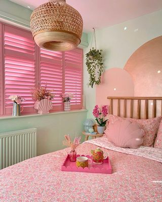 Pink and green bedroom with pastel accents