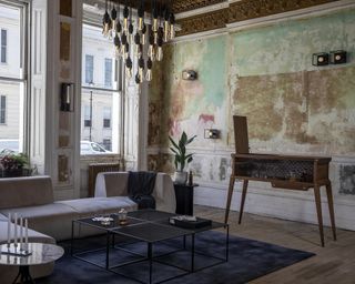 A living room wall lighting idea by Nest in Brutalist scheme with distressed walls