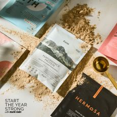 A flat lay of some of the best protein powders for women, including travel sachets from Form Nutrition, Hermosa, Innermost, MyProtein and more