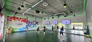 OHM Fitness donned in neon lights and a Pioneer PRO AUDIO sound system.