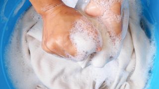 Handwashing cashmere in soapy water