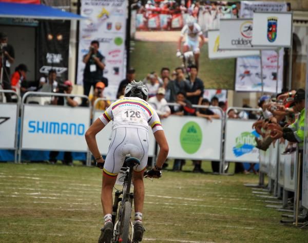 A Colombian racer speeds toward the line
