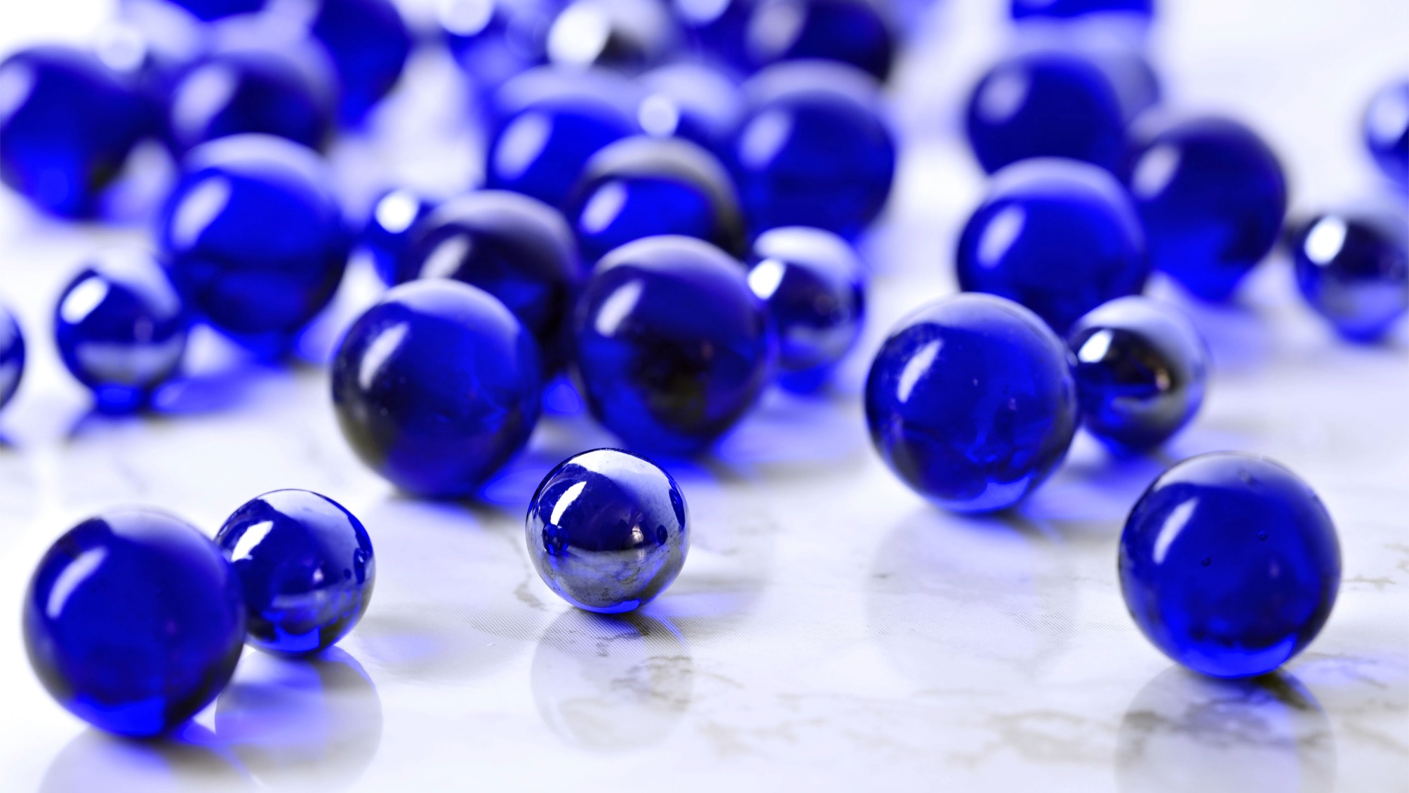 Close up of blue glass marbles