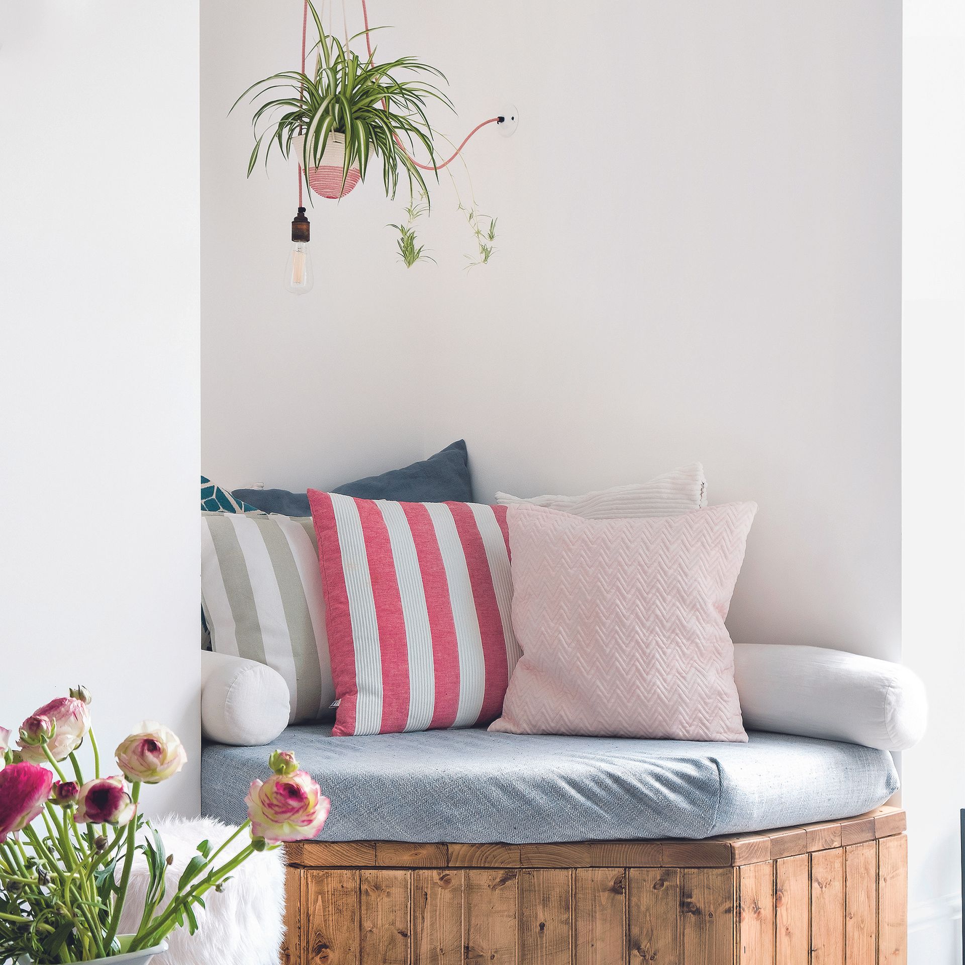 Living room with built-in corner seating area with cushions.
