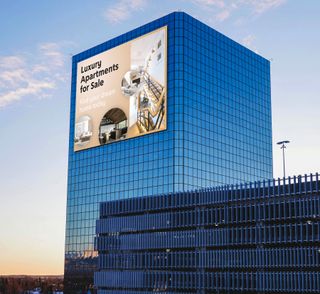 PPDS enters the outdoor display market, with its massive LED on a tall skyscraper shown here.