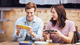 Two people playing Nintendo Switch Lite