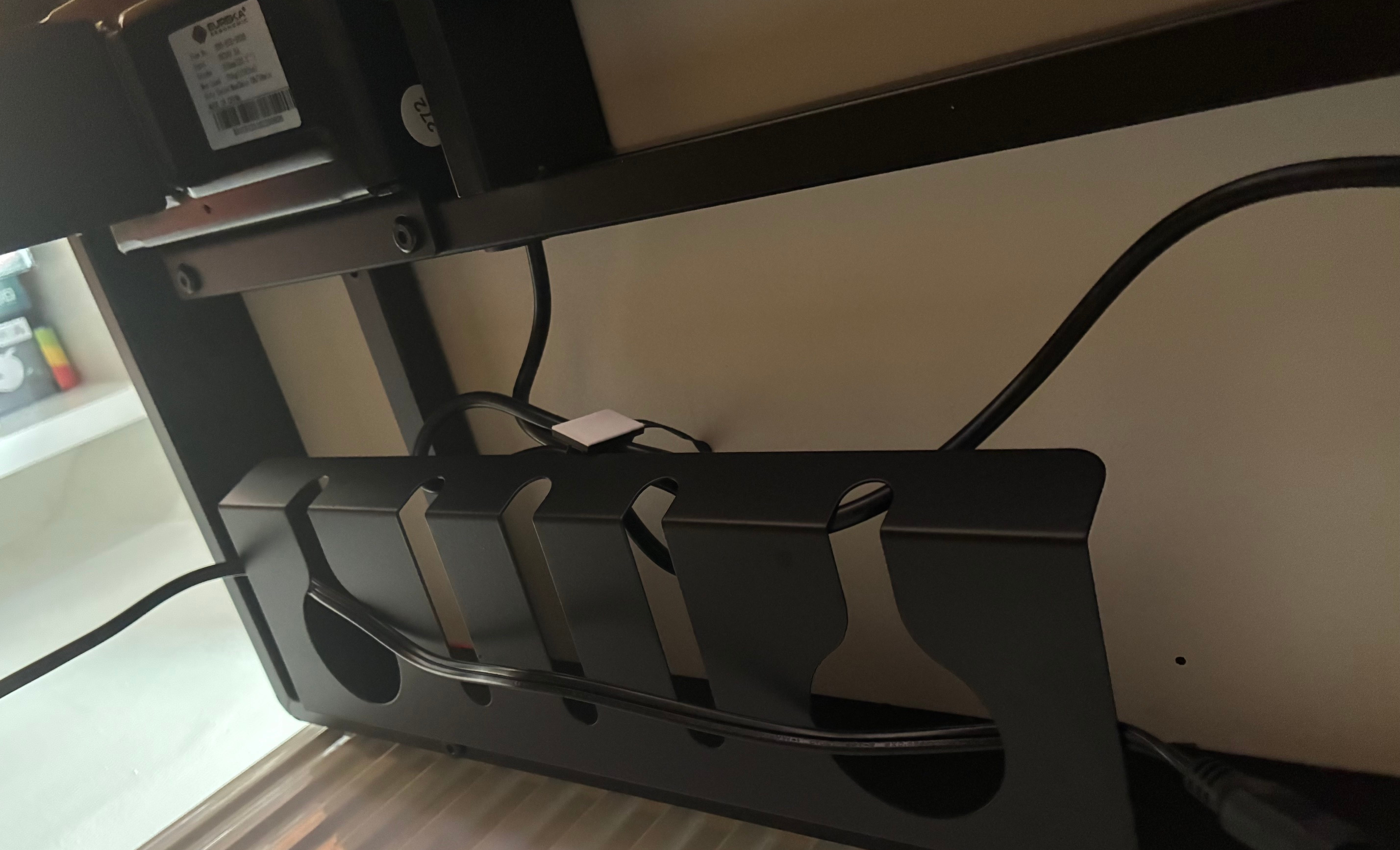 The cable storage as seen underneath the Eureka Ergonomic Wonder desk