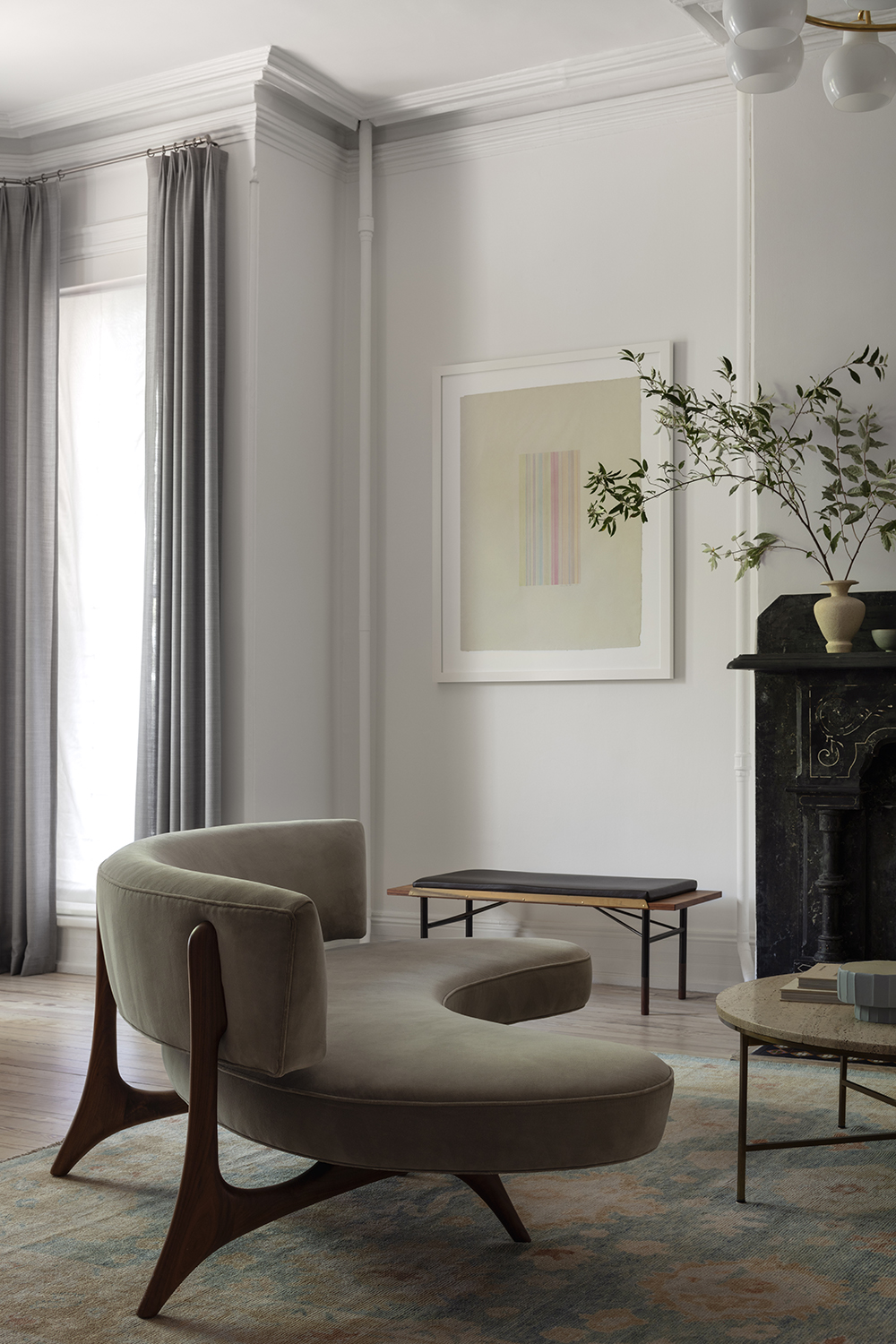 neutral living room with curved sofa