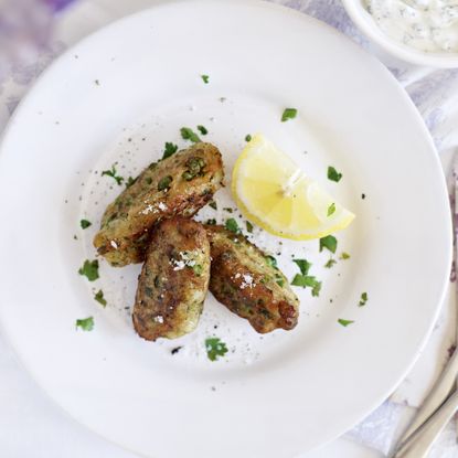 Crispy pea fritters with minty yoghurt-woman and home