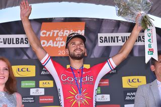 Nacer Bouhanni celebrates on the podium after winning Dauphine's first stage