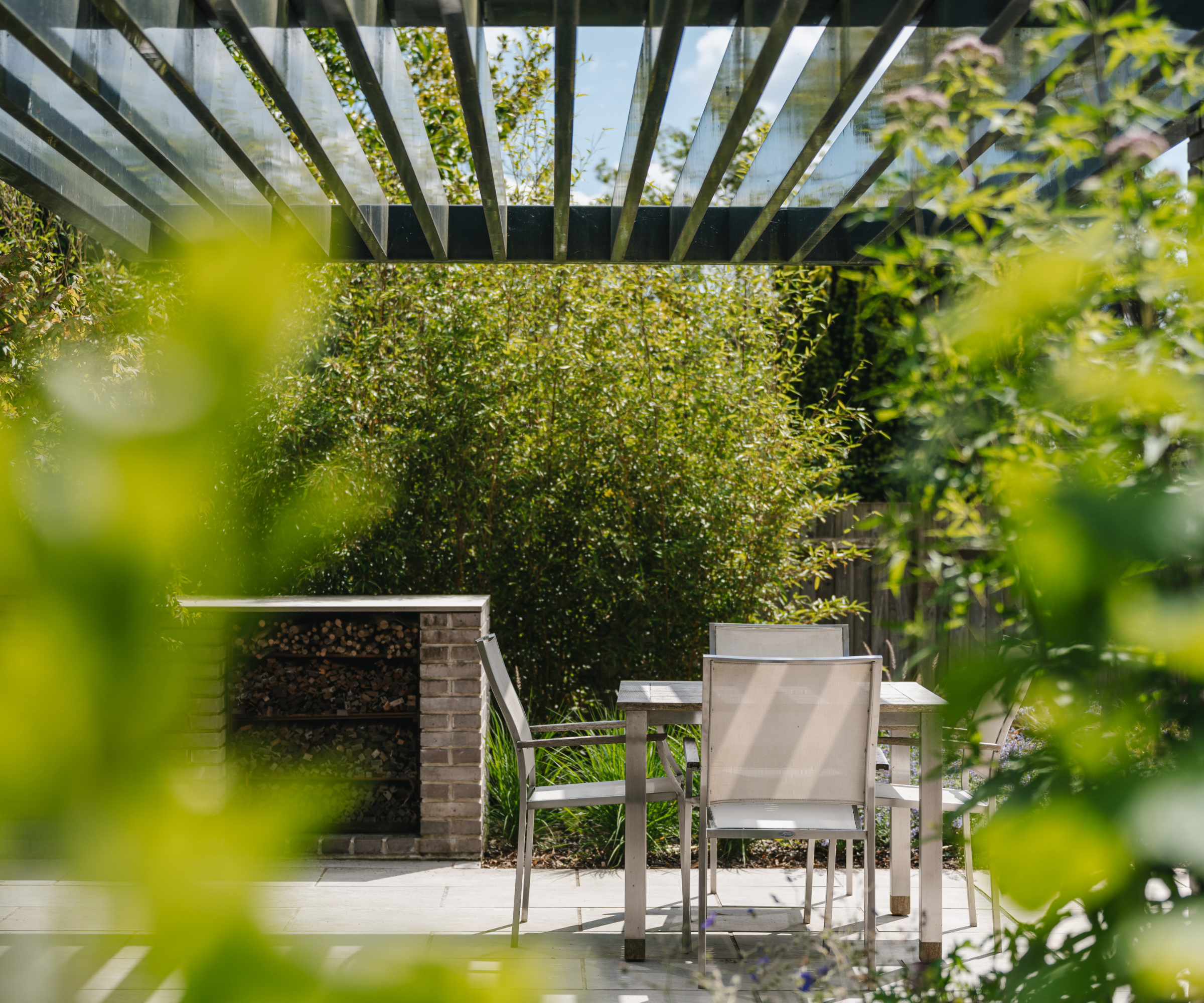 Table and chairs under pergola