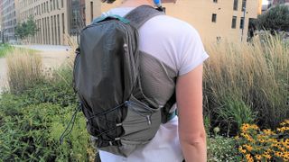 Woman wearing Nathan Crossover Pack 10L running backpack