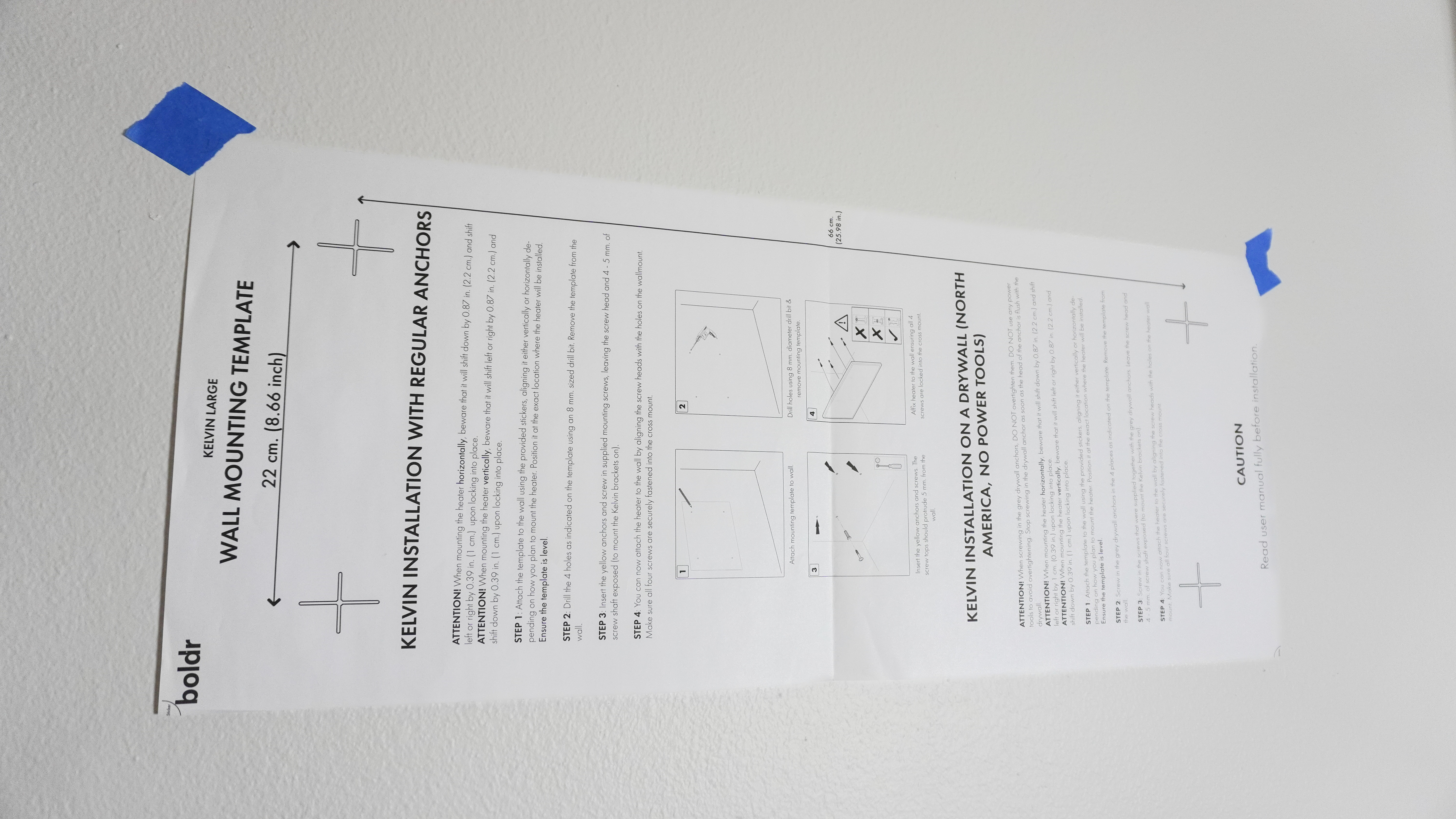 The included template for the Boldr Kelvin taped to a wall