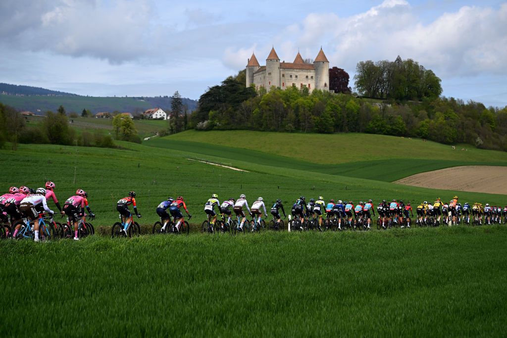 VALLE DE JOUX SWITZERLAND APRIL 26 A general view of the peloton passing near to Champvent Castle during the 76th Tour De Romandie 2023 Stage 1 a 1709km stage from Crissier to Valle de Joux 1019m UCIWT on April 26 2023 in Valle de Joux Switzerland Photo by Dario BelingheriGetty Images