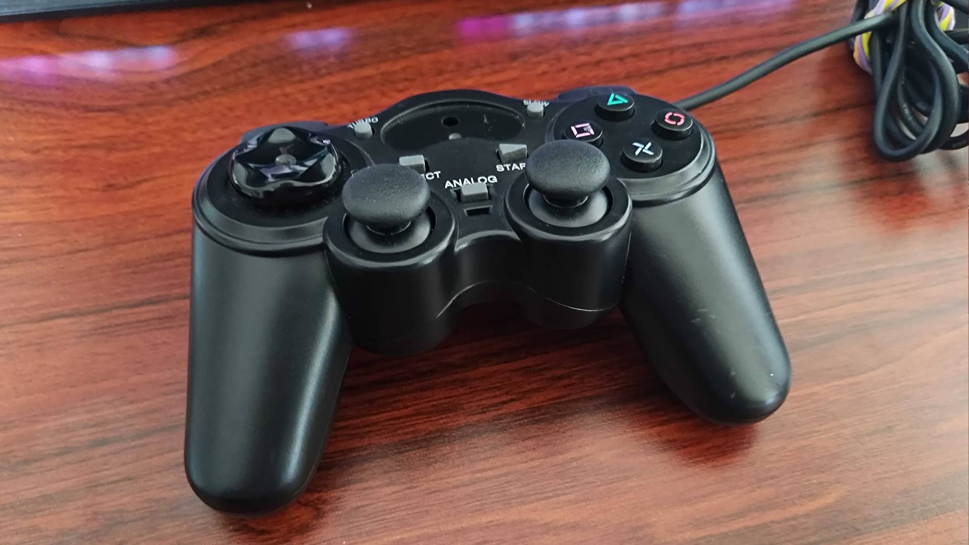 Generic third party PS2 controller on desk.
