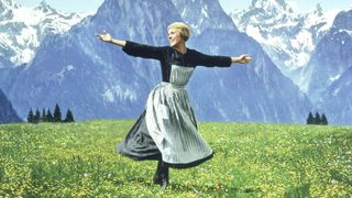 Julie Andrews dancing in a field