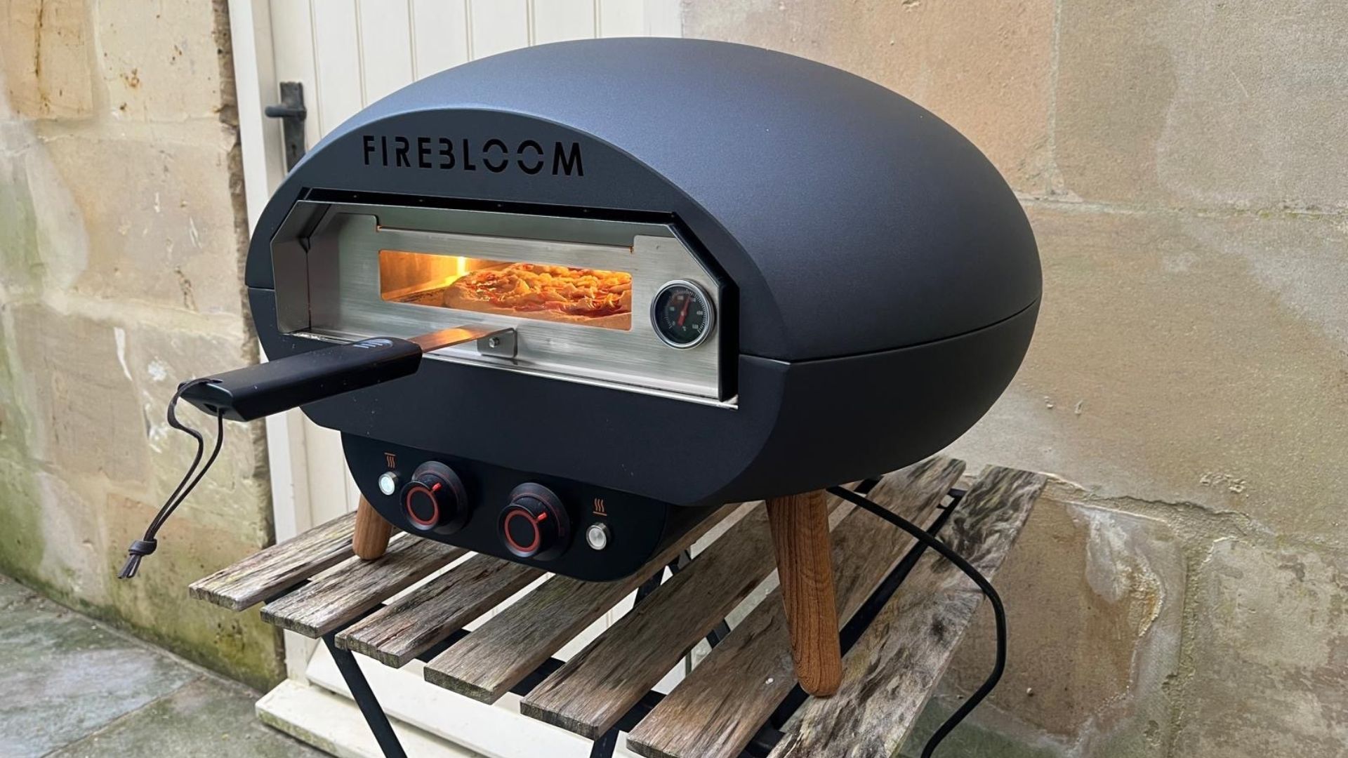The Firebloom EP03 Electric Pizza Oven being tested in a courtyard