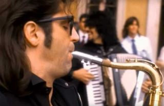 A still from the November Rain video showing the wedding band playing