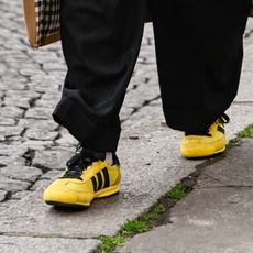 nikki ogunnaike wearing yellow shoes