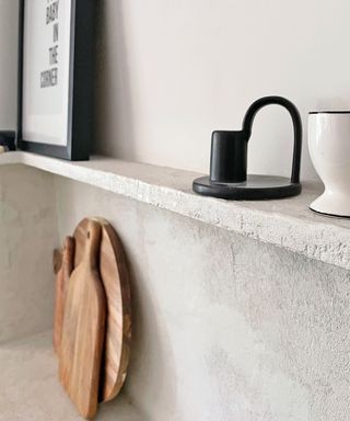 microcement backsplash behind kitchen hob