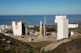 The Delta IV Heavy rocket carrying the NROL-71 spy satellite for the U.S. National Reconnaissance Office is seen during tower rollback operations at Space Launch Complex-6 at Vandenberg Air Force Base in California.