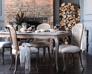 A grey dining room idea with the Camille Limewash Oak table and six chairs
